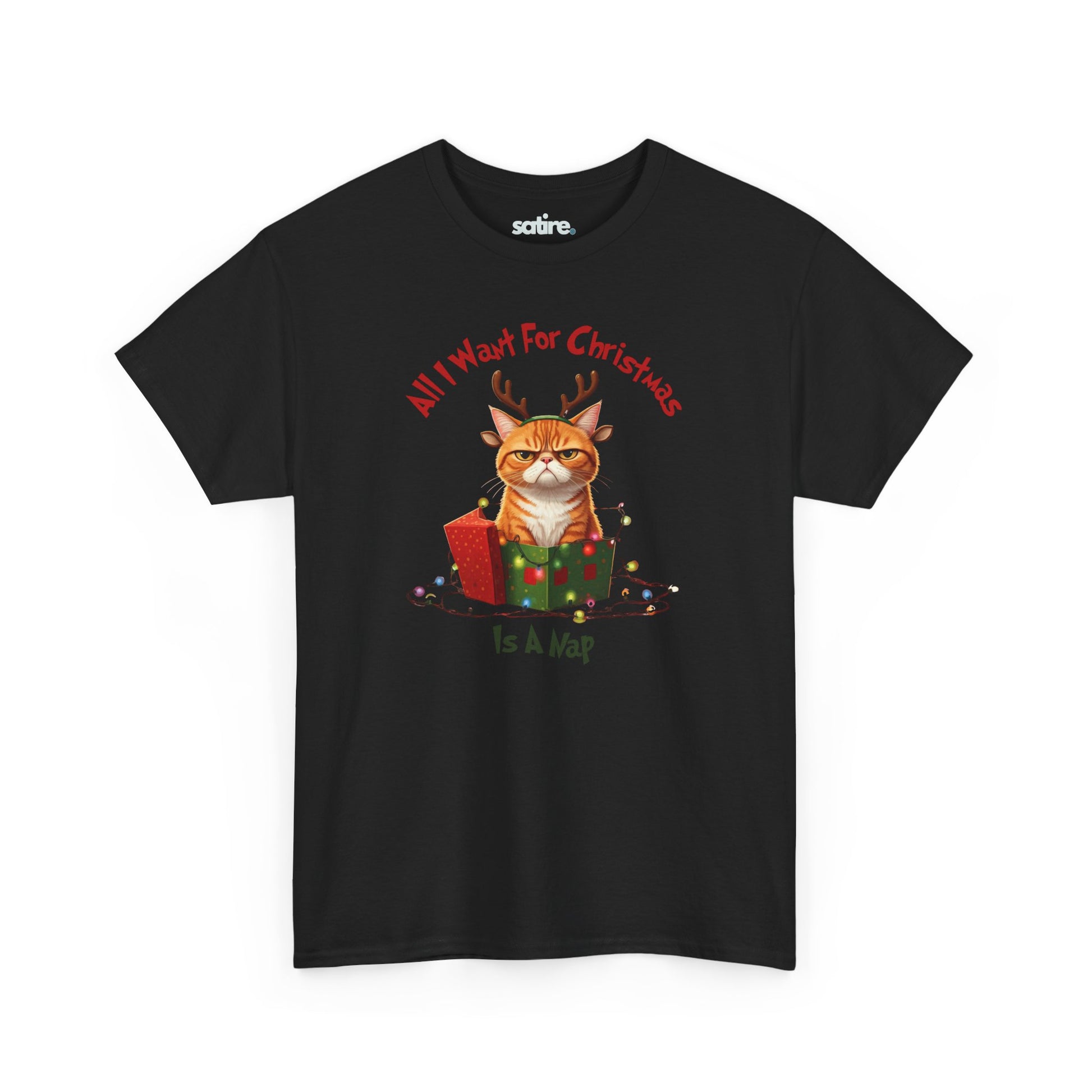 A black t-shirt featuring an image of an angry cat with reindeer antlers sitting in a Christmas present surrounded by lights. The text reads, "All I want for Christmas is a nap."  | Satire Clothes