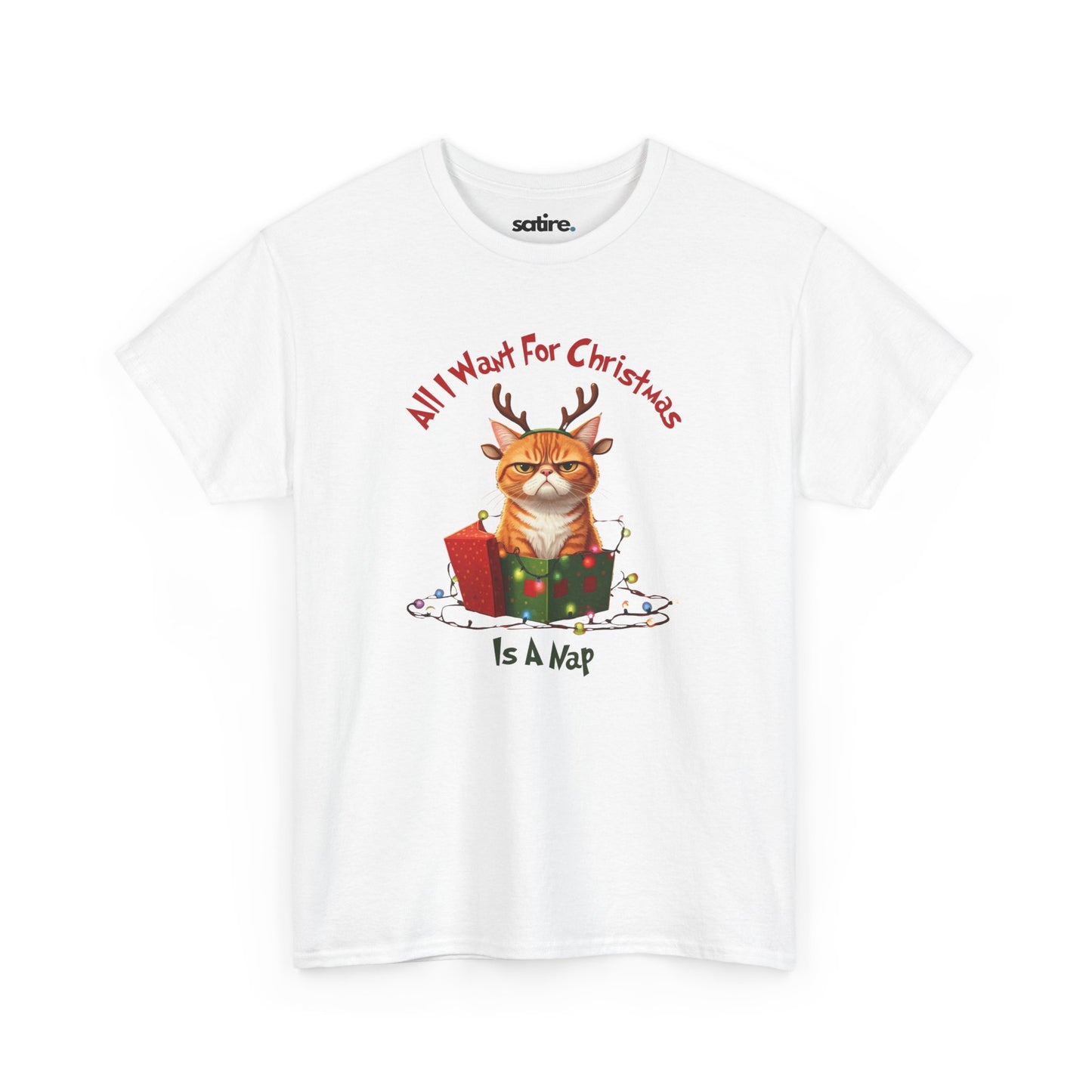 A white t-shirt featuring an image of an angry cat with reindeer antlers sitting in a Christmas present surrounded by lights. The text reads, "All I want for Christmas is a nap."  | Satire Clothes