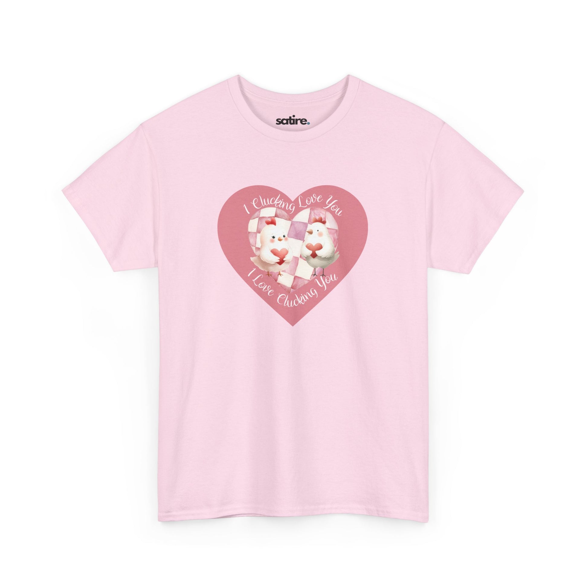 Light pink t-shirt featuring a pink heart-shaped design with two cartoon chickens holding a heart. The text on the shirt reads "I Clucking Love You .. I Love Clucking You" in a playful font. | Satire Clothes