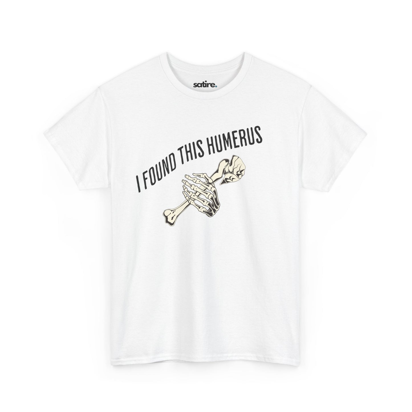 White t-shirt with the text 'I FOUND THIS HUMERUS' printed in black. Below the text, there's an illustration of a skeletal hand holding a humerus bone. | Satire Clothes