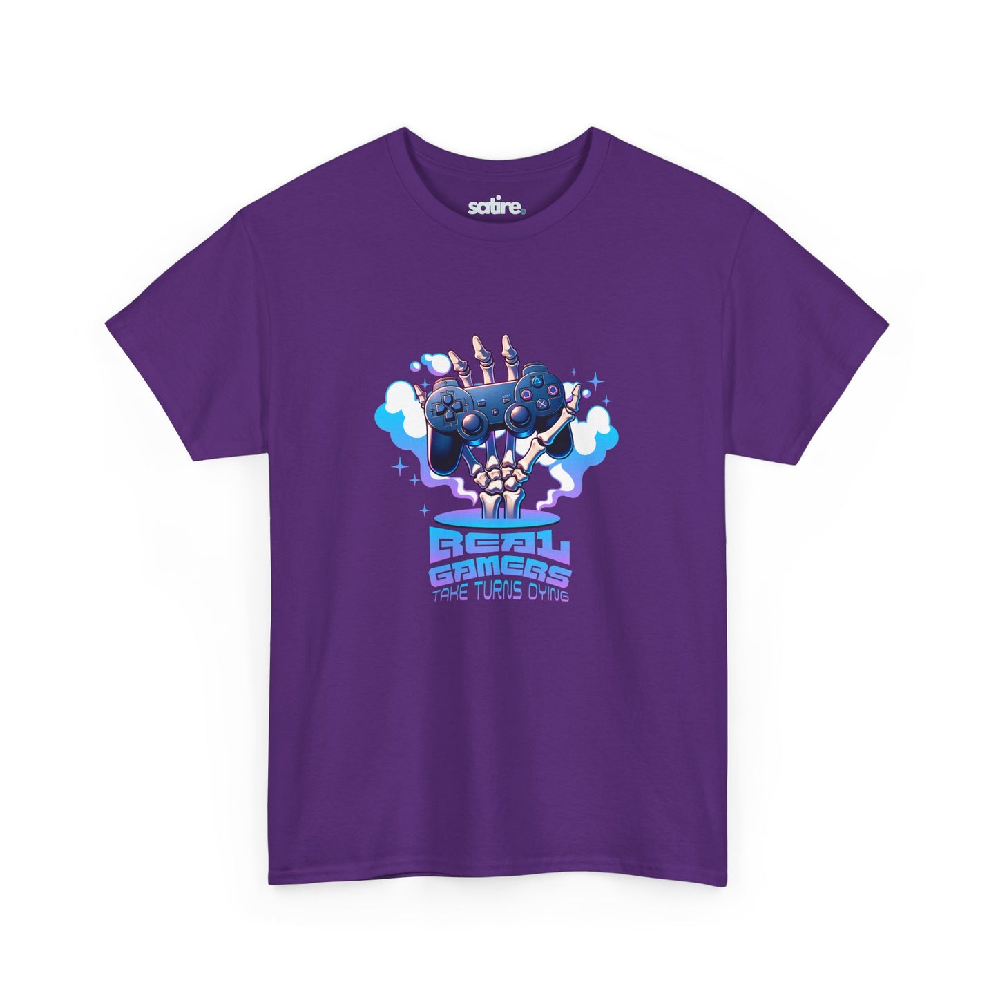 Purple T-shirt featuring a colorful graphic of a skeletal hand holding a game controller with clouds of smoke, above the text 'REAL GAMERS TAKE TURNS DYING' | Satire Clothes