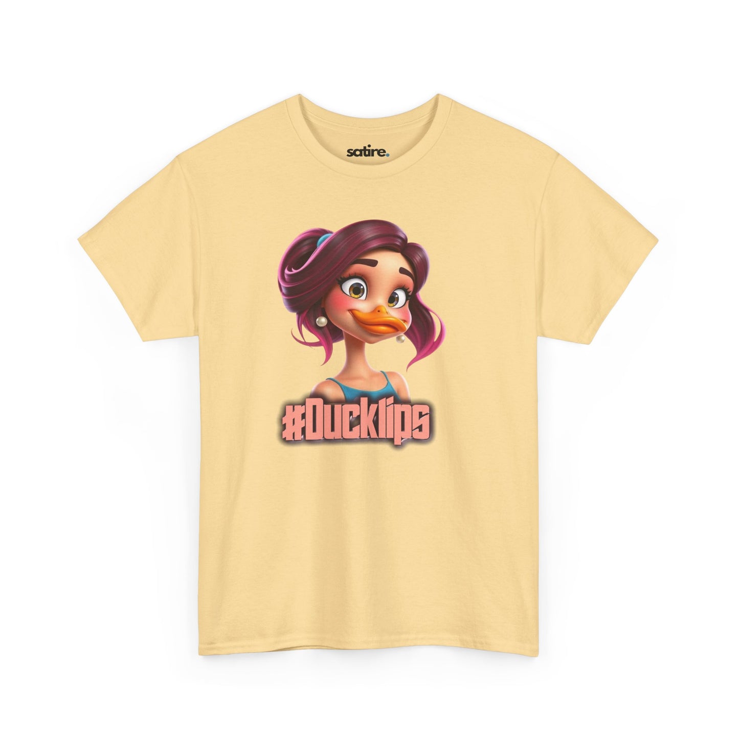 Light yellow t-shirt featuring a colorful cartoon character with purple hair and a duck bill, wearing a blue top, with the text '#Ducklips' in bold letters below the image | Satire Clothes