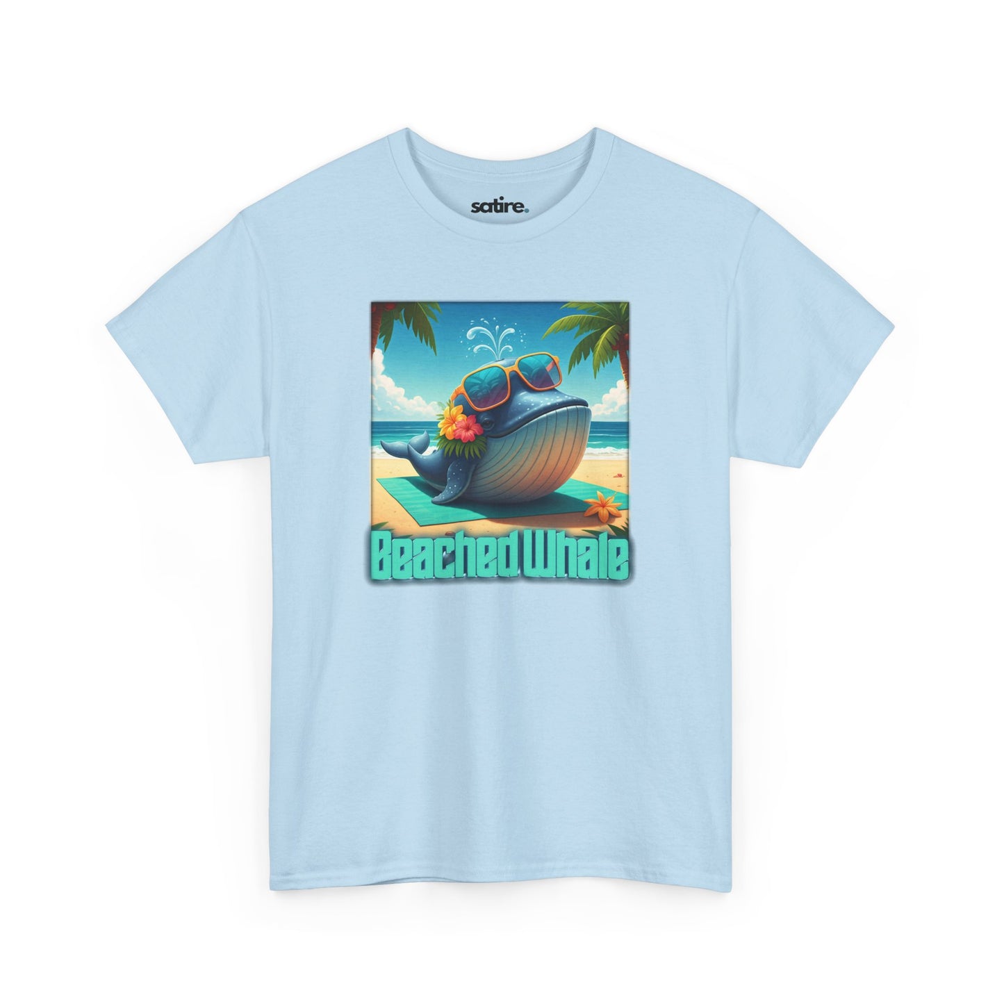 Light blue t-shirt with a graphic of a whale on a beach, wearing sunglasses with flowers tucked into the sunglasses. Text below reads 'Beached Whale' | Satire Clothes