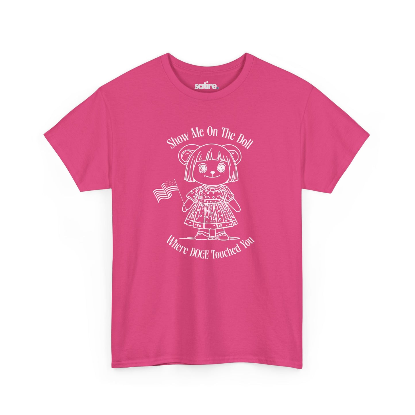 Pink t-shirt with a white graphic of a doll holding an American flag. The text reads: "Show Me On The Doll Where DOGE Touched You" | Satire Clothes