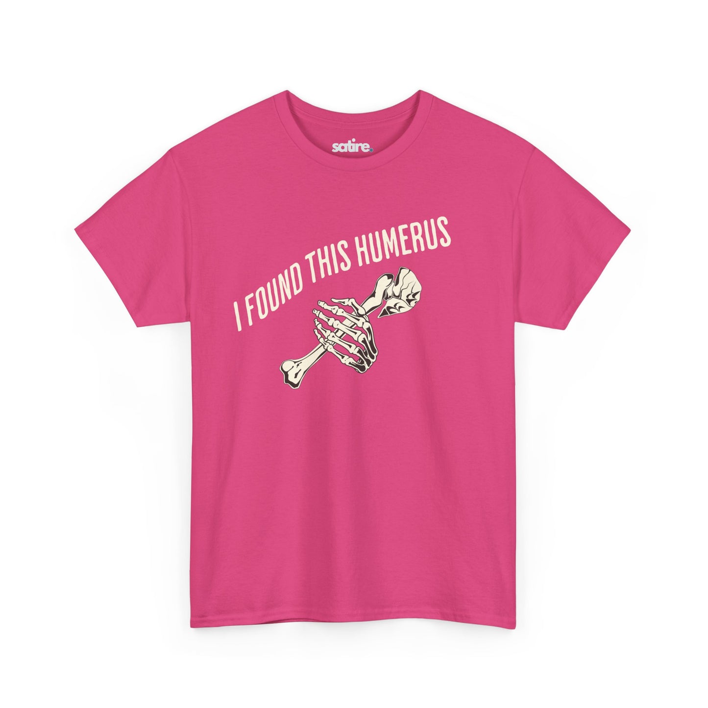 Pink t-shirt with the text 'I FOUND THIS HUMERUS' printed in white. Below the text, there's an illustration of a skeletal hand holding a humerus bone. | Satire Clothes