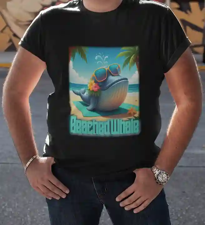 Man wearing a black t-shirt with a graphic of a whale on a beach, wearing sunglasses with flowers tucked into the sunglasses. Text below reads 'Beached Whale' | Satire Clothes