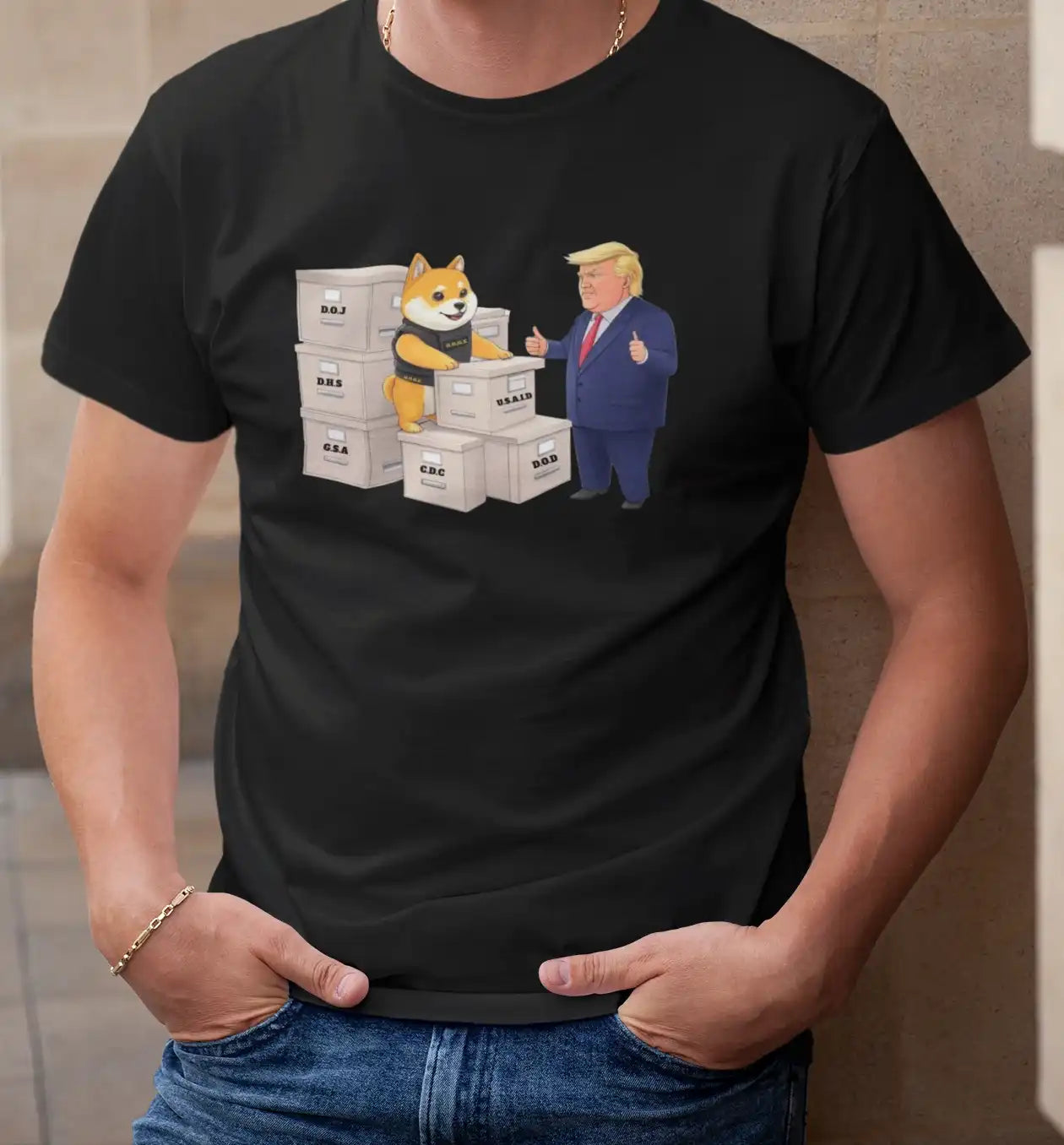 A man in a black t-shirt featuring D.O.G.E, a Shiba Inu in a black vest, inspecting government-labeled boxes, with a caricature of President Trump giving a thumbs up | Satire Clothes