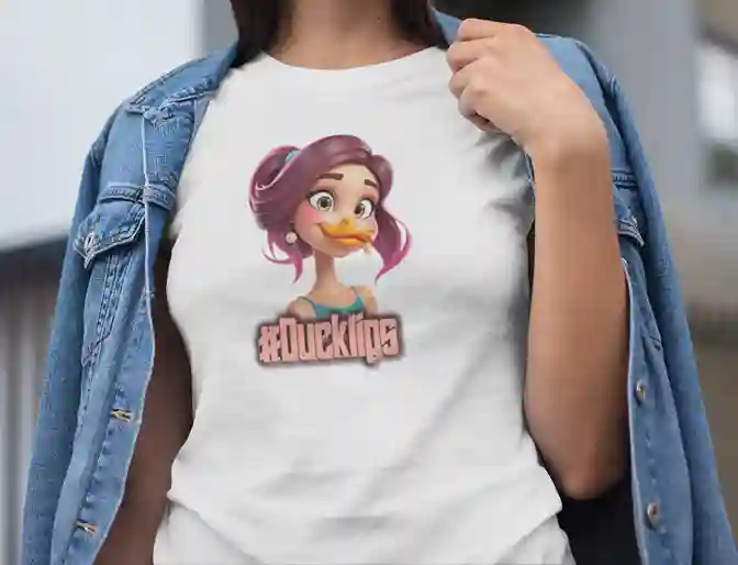 Woman wearing a white t-shirt featuring a colorful cartoon character with purple hair and a duck bill, wearing a blue top, with the text '#Ducklips' in bold letters below the image | Satire Clothes