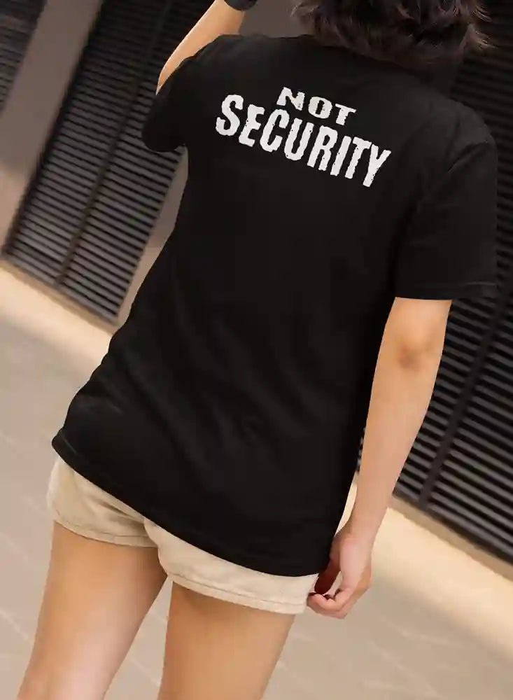 Woman wearing a black t-shirt with "NOT SECURITY" printed on the back.