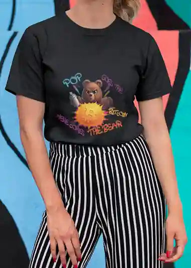 Woman wearing black t-shirt with a humorous design featuring a bear holding a spray can, popping a Bitcoin symbol. Surrounding the bear, colorful graffiti text reads "POP! Goes the Bitcoin, Here Comes The Bear" | Satire Clothes