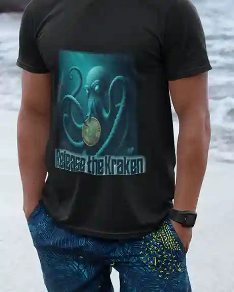 A man wearing a black t-shirt with a graphic of a kraken holding a Bitcoin coin underwater, with the text "Release the Kraken" below the image | Satire Clothes.