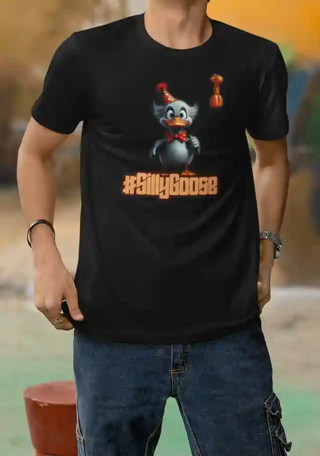 A man wearing a black t-shirt featuring a cartoon goose wearing a party hat and holding a giraffe balloon, with the text "#SillyGoose" printed below the image | Satire Clothes