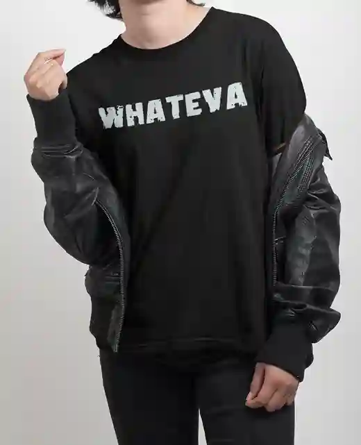 A woman wearing a black t-shirt with the word "WHATEVA" printed in large, distressed white letters across the front. | Satire Clothes